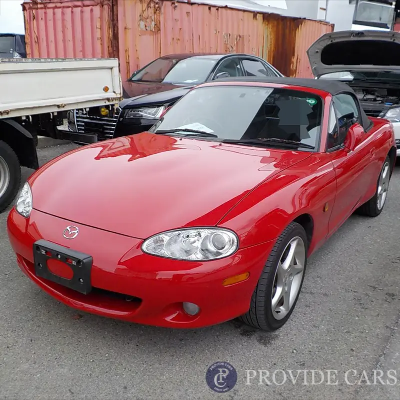 Red Mazda convertible purchased from Japan car auction, ready for export.