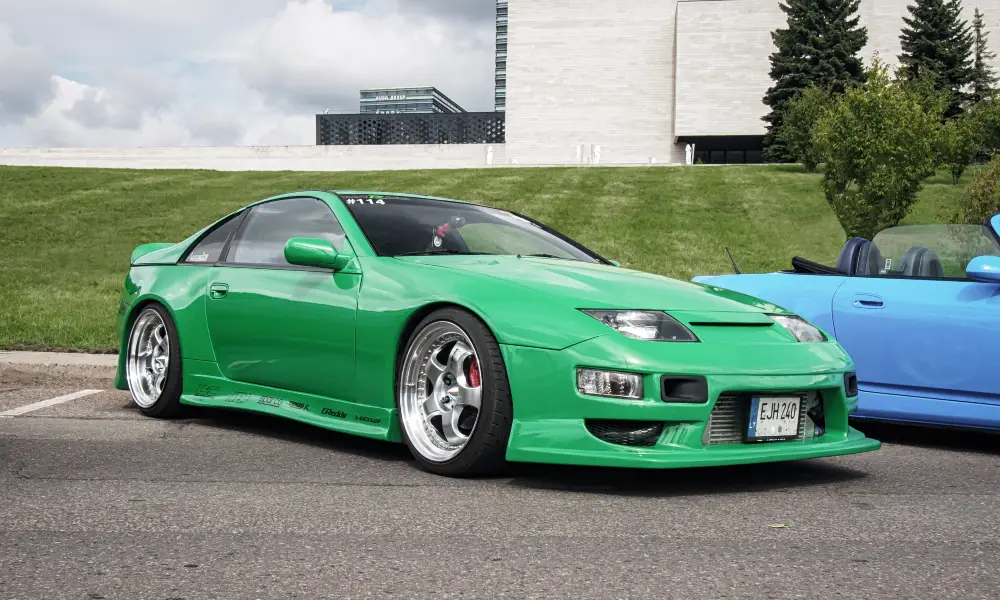 A striking green JDM icon, the Nissan 300ZX, known for its powerful performance and sleek lines.