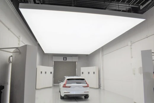 Rear view of a Volvo under JU Gifu's indirect lighting setup, enhancing vehicle images for Japan Car Auction buyers.