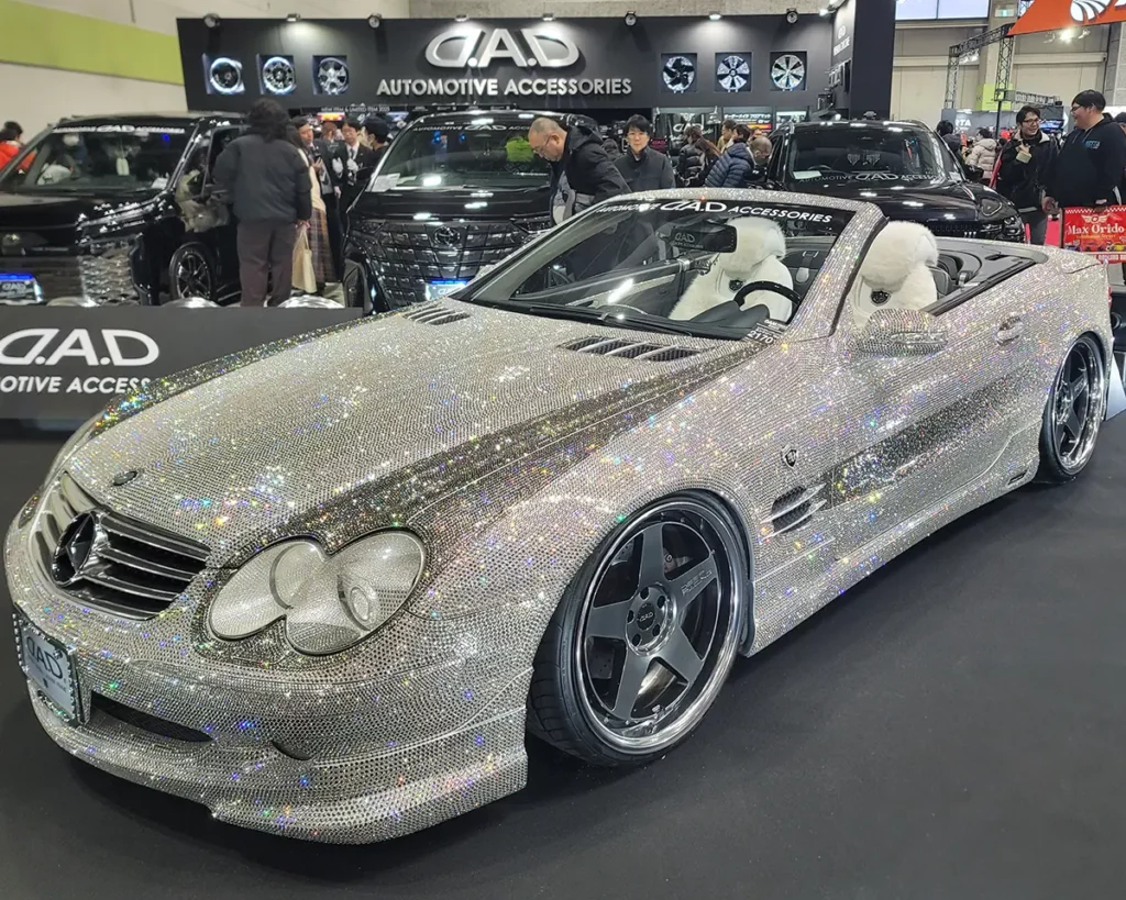 A Mercedes-Benz SL (R230) covered in Swarovski crystals, showcasing D.A.D's signature luxury customization.