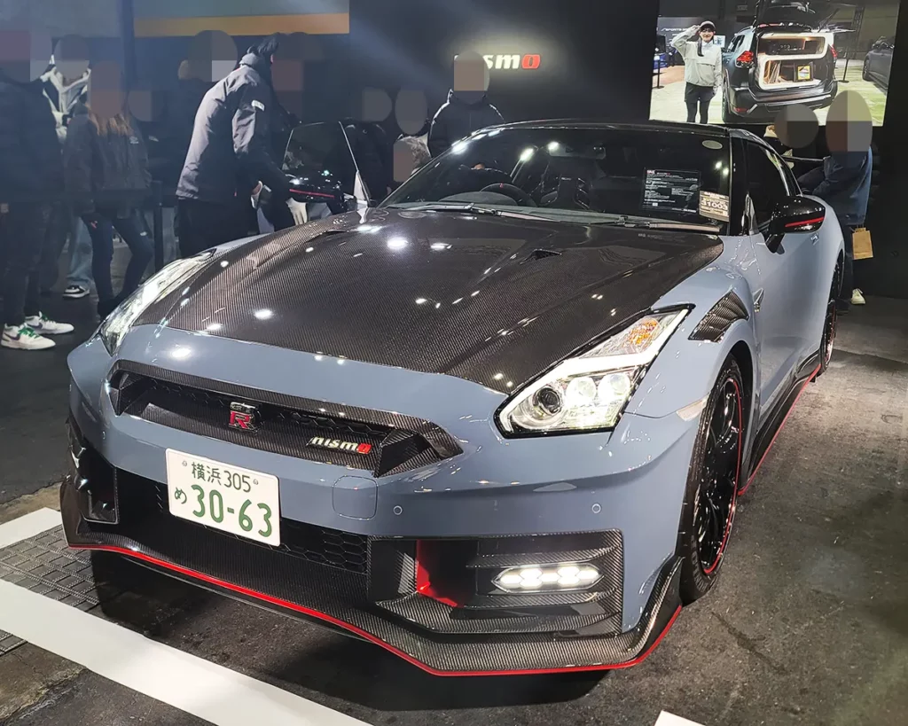 A Nissan GT-R NISMO dressed in Stealth Gray with a carbon hood, combining high performance with a bold design.