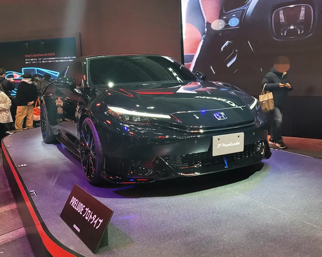 The upcoming Honda Prelude, set for release in fall 2025. A sleek black body enhances its sporty appeal.