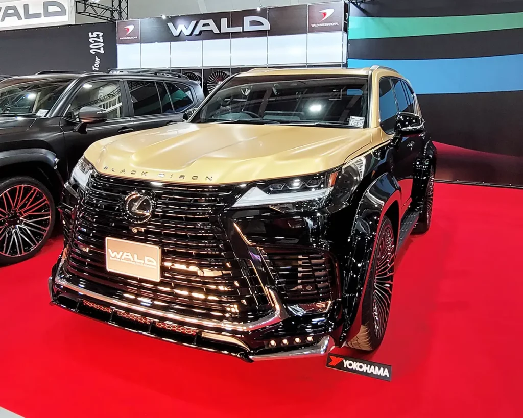 A luxury-custom Lexus LX by WALD International, featuring a striking black and gold two-tone finish.