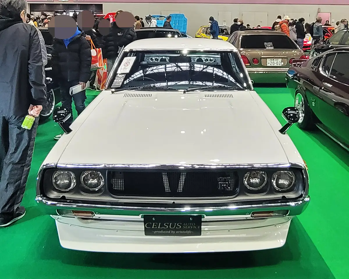 A pristine Nissan Skyline GC111, showcasing classic JDM styling at CELSUS AUTO SERVICE’s booth.